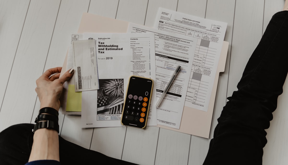 Person planning local services on a desk